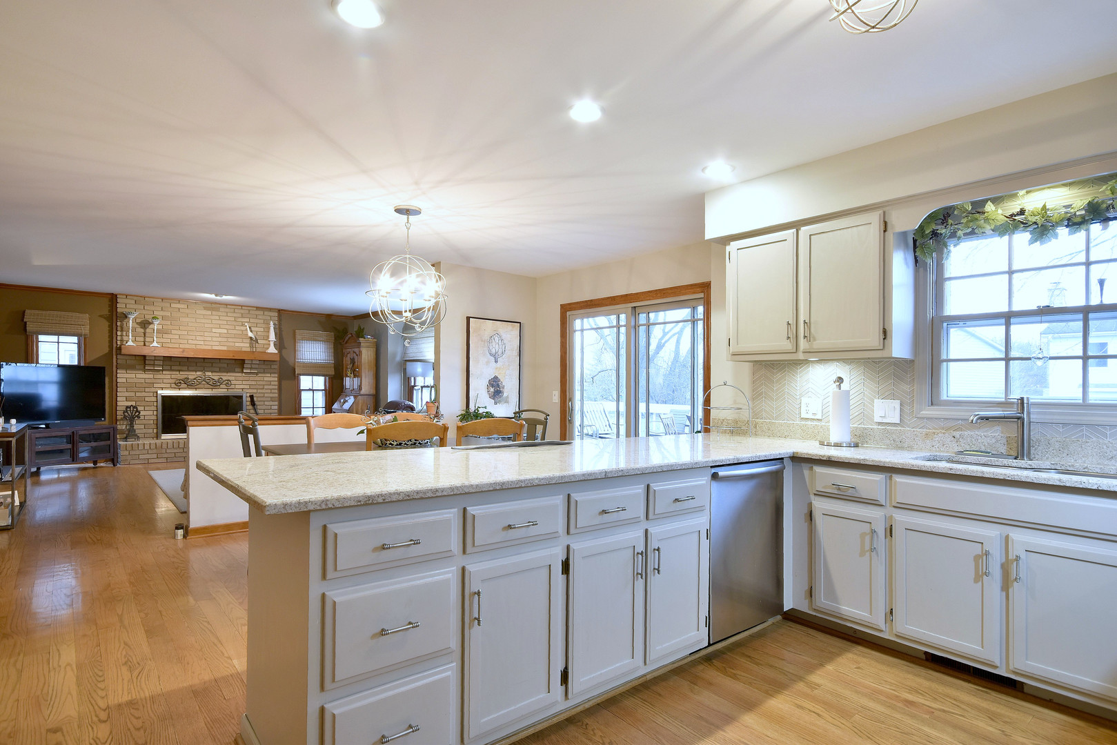 2535 Sun Valley Road Lisle, IL 60532 - Photo 21 of 54 a kitchen with sink stove and cabinets