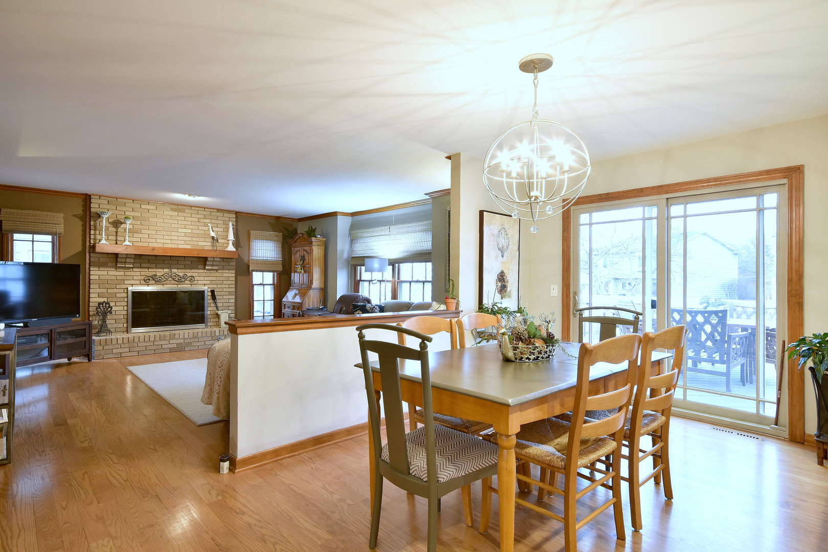2535 Sun Valley Road Lisle, IL 60532 - Photo 22 of 54 a view of a dining room with furniture window and wooden floor