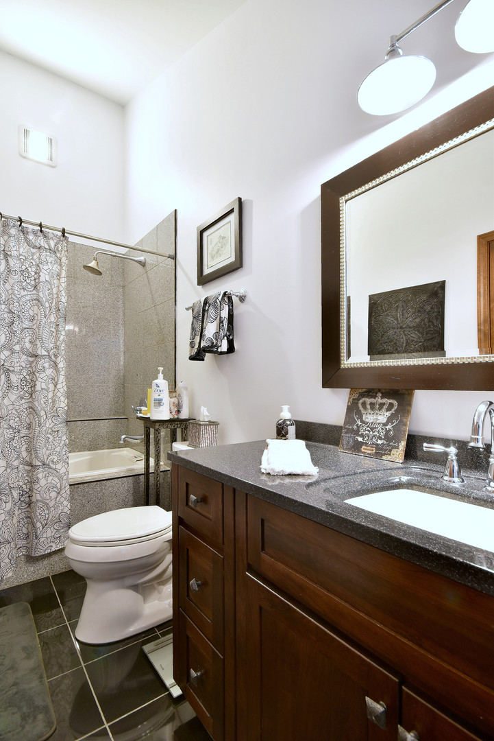 2535 Sun Valley Road Lisle, IL 60532 - Photo 30 of 54 a bathroom with a toilet a sink and mirror