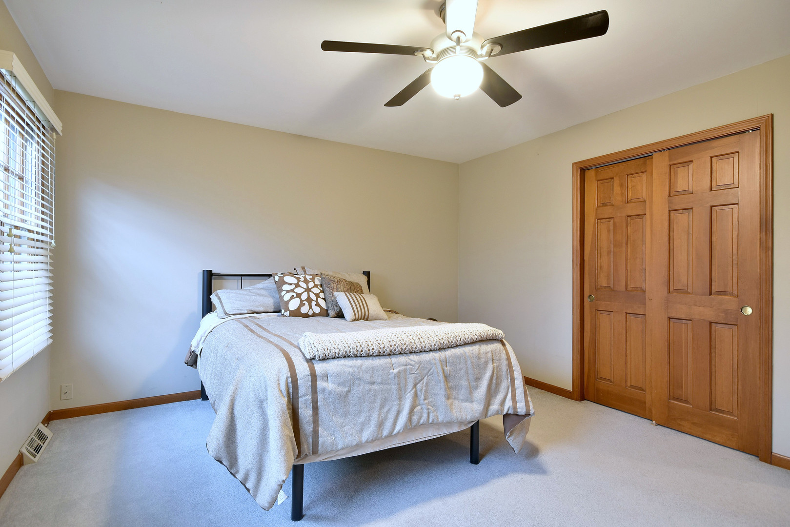 2535 Sun Valley Road Lisle, IL 60532 - Photo 33 of 54 a bedroom with a bed and a chandelier
