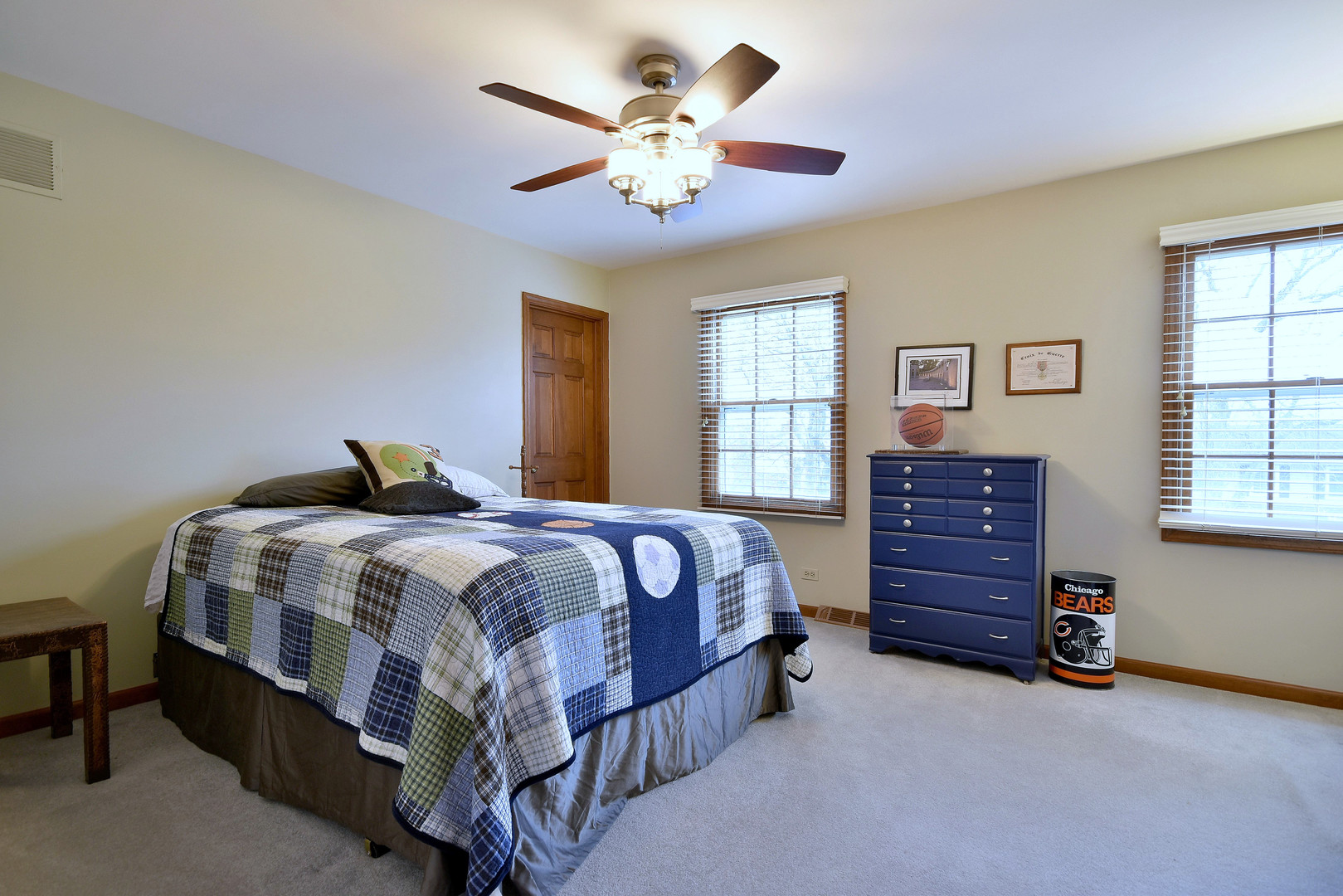 2535 Sun Valley Road Lisle, IL 60532 - Photo 35 of 54 a bedroom with a bed and a chandelier