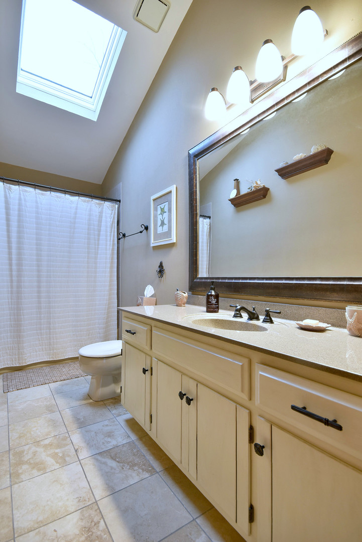 2535 Sun Valley Road Lisle, IL 60532 - Photo 37 of 54 a bathroom with a sink a toilet and mirror
