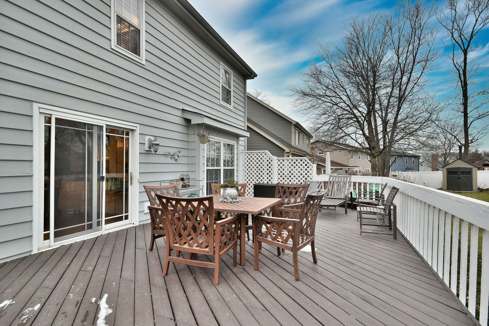 2535 Sun Valley Road Lisle, IL 60532 - Photo 53 of 54 a view of a roof deck with table and chairs and wooden floor