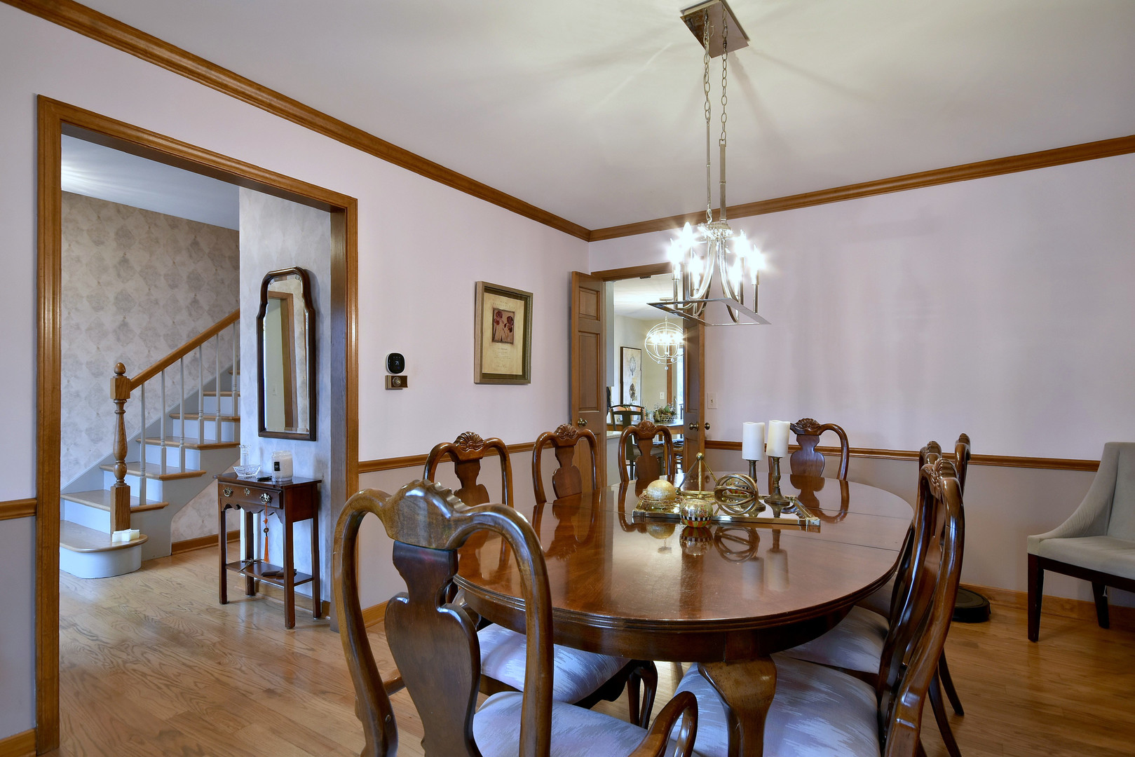 2535 Sun Valley Road Lisle, IL 60532 - Photo 10 of 54 a view of a dining room with furniture and chandelier