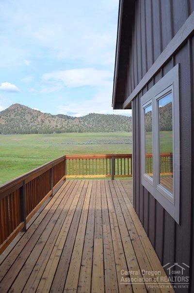 2346 Northeast Yellowpine Road Prineville, OR 97754 - Photo 13 of 24 Deck surrounds the Back of the House and