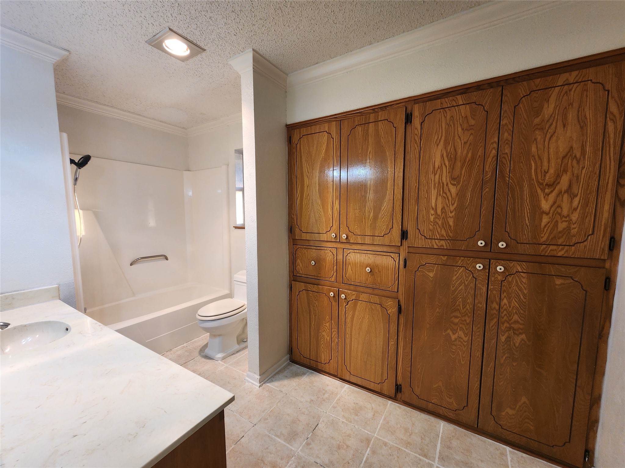 2000 Donna Drive Taylor, TX 76574 - Photo 15 of 27 a bathroom with a granite countertop sink toilet and shower