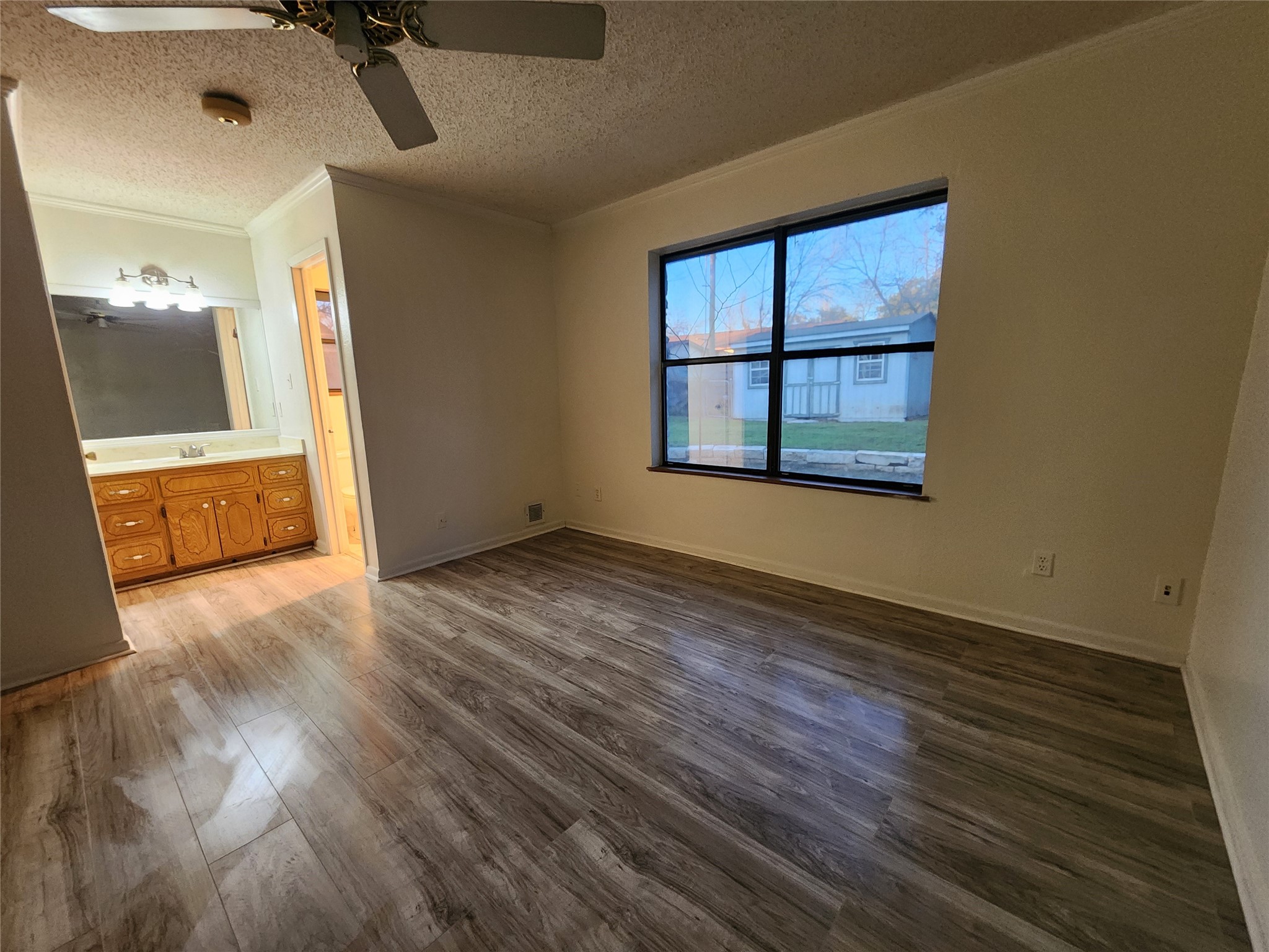 2000 Donna Drive Taylor, TX 76574 - Photo 16 of 27 an empty room with wooden floor and windows