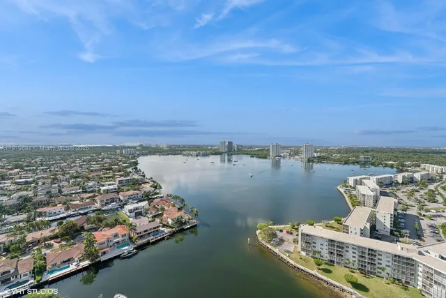 an aerial view of a house with a lake view