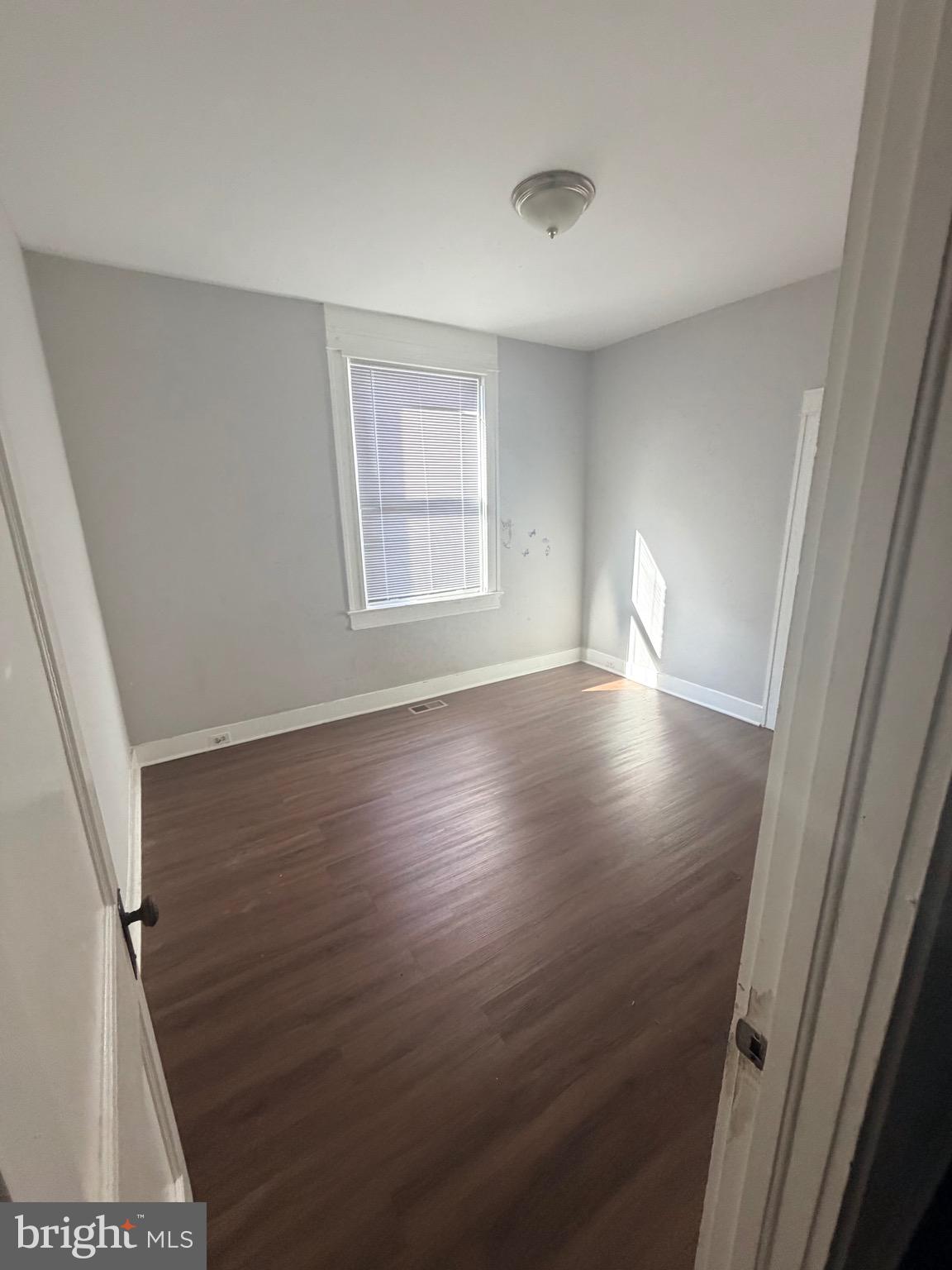 412 East Cold Spring Lane Baltimore, MD 21212 - Photo 5 of 8 a view of livingroom with hardwood floor and window