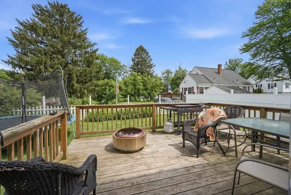 a view of a deck with two chair and a potted plant