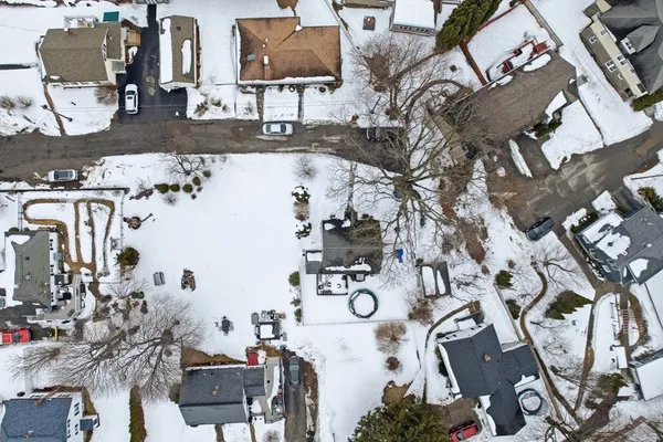 an aerial view of a house with outdoor space