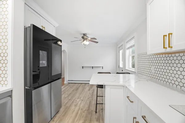a spacious bathroom with a sink a mirror and a shower