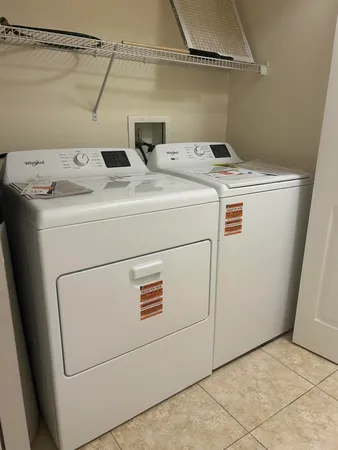 a utility room with dryer and washer