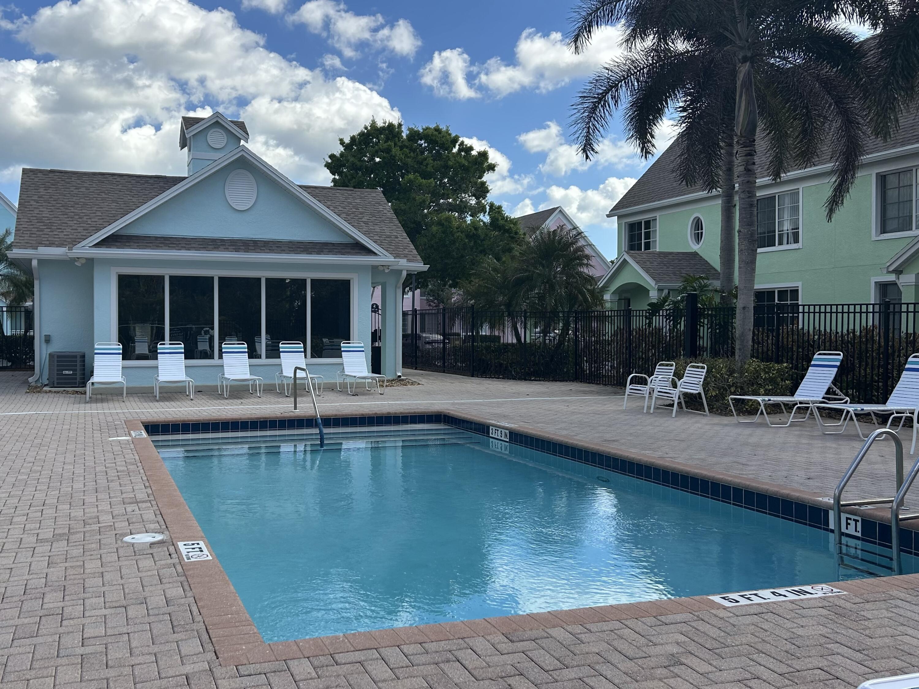 1687 Southeast Pomeroy Street Stuart, FL 34997 - Photo 18 of 20 a view of a house with swimming pool and sitting area