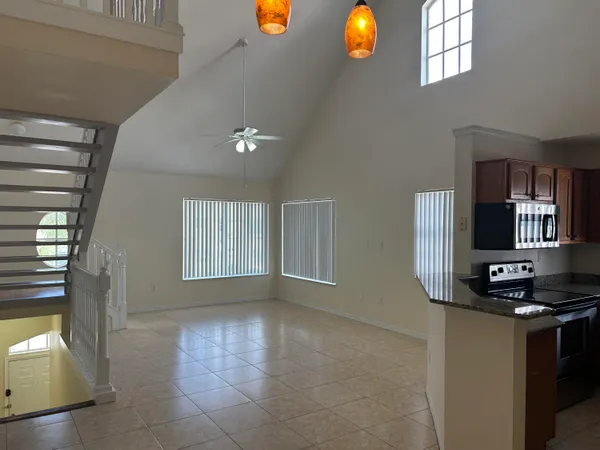 a kitchen with a refrigerator and window