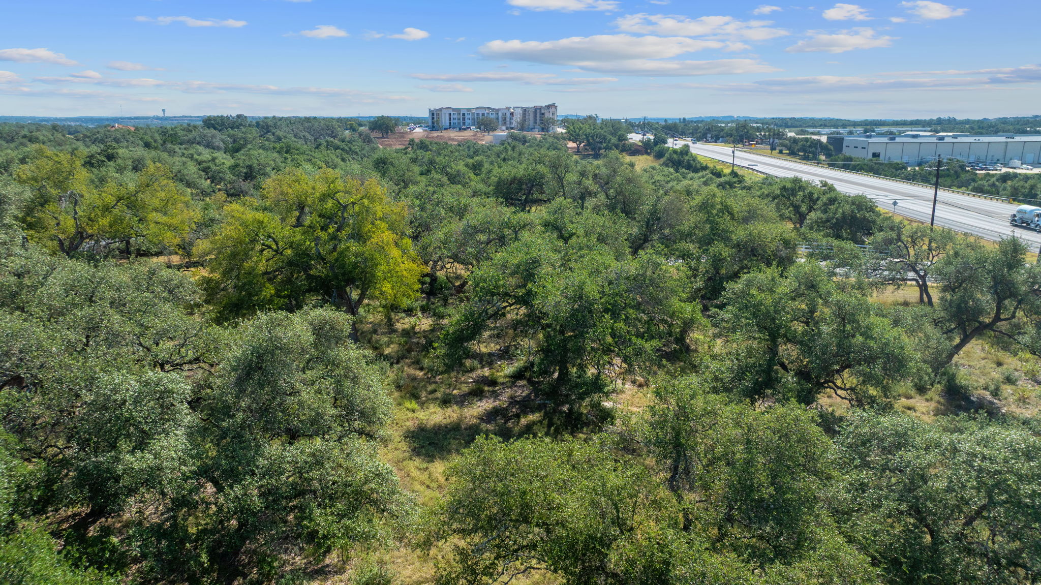 Tbd Tbd Tbd Troutwein Road Southwest Austin, TX 78737 - Photo 11 of 13 an aerial view of a city with lots of residential buildings ocean and mountain view in back