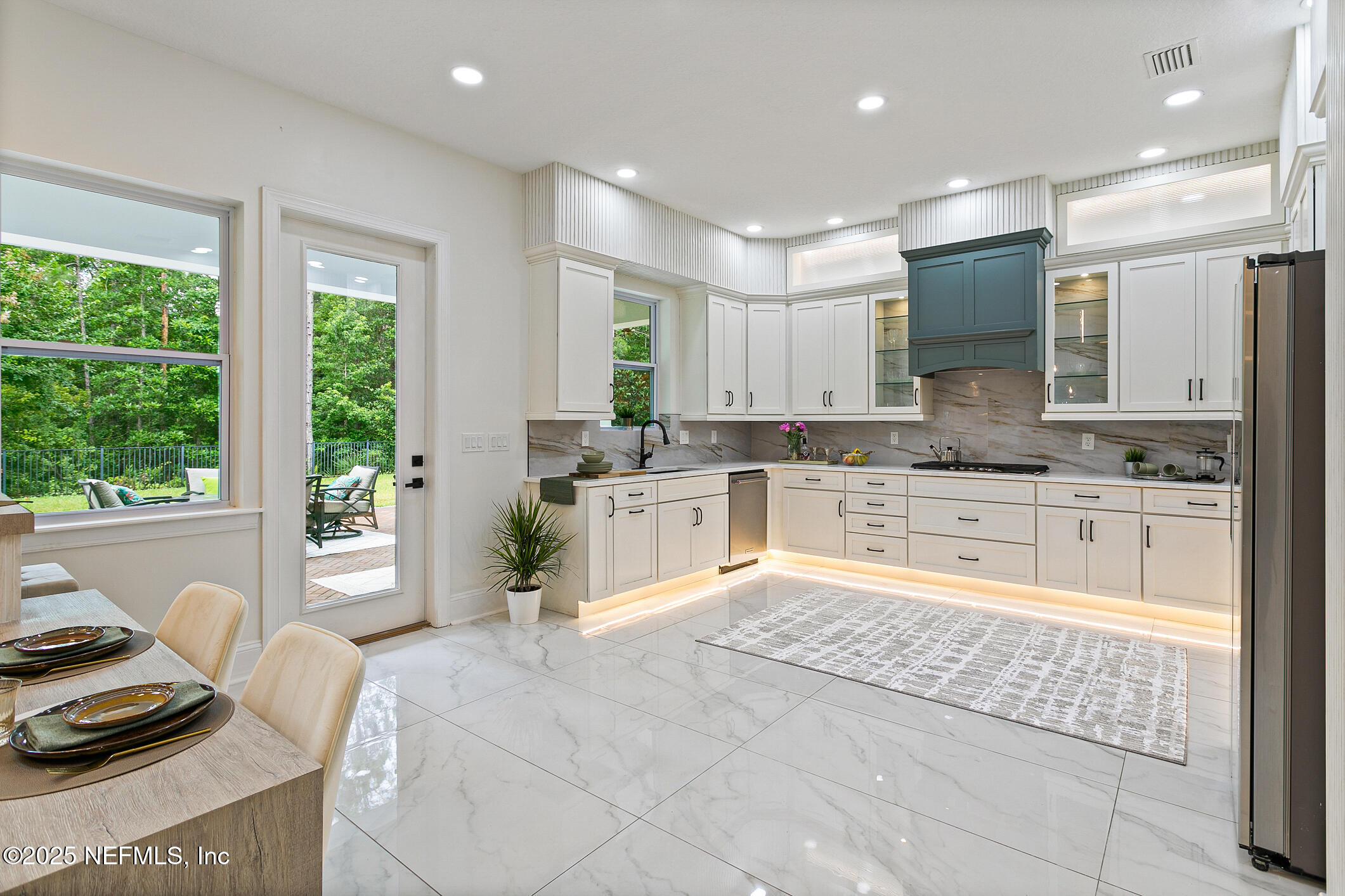 124 Mollusk Road St. Johns, FL 32259 - Photo 17 of 94 a large white kitchen with granite countertop a stove a sink and a refrigerator