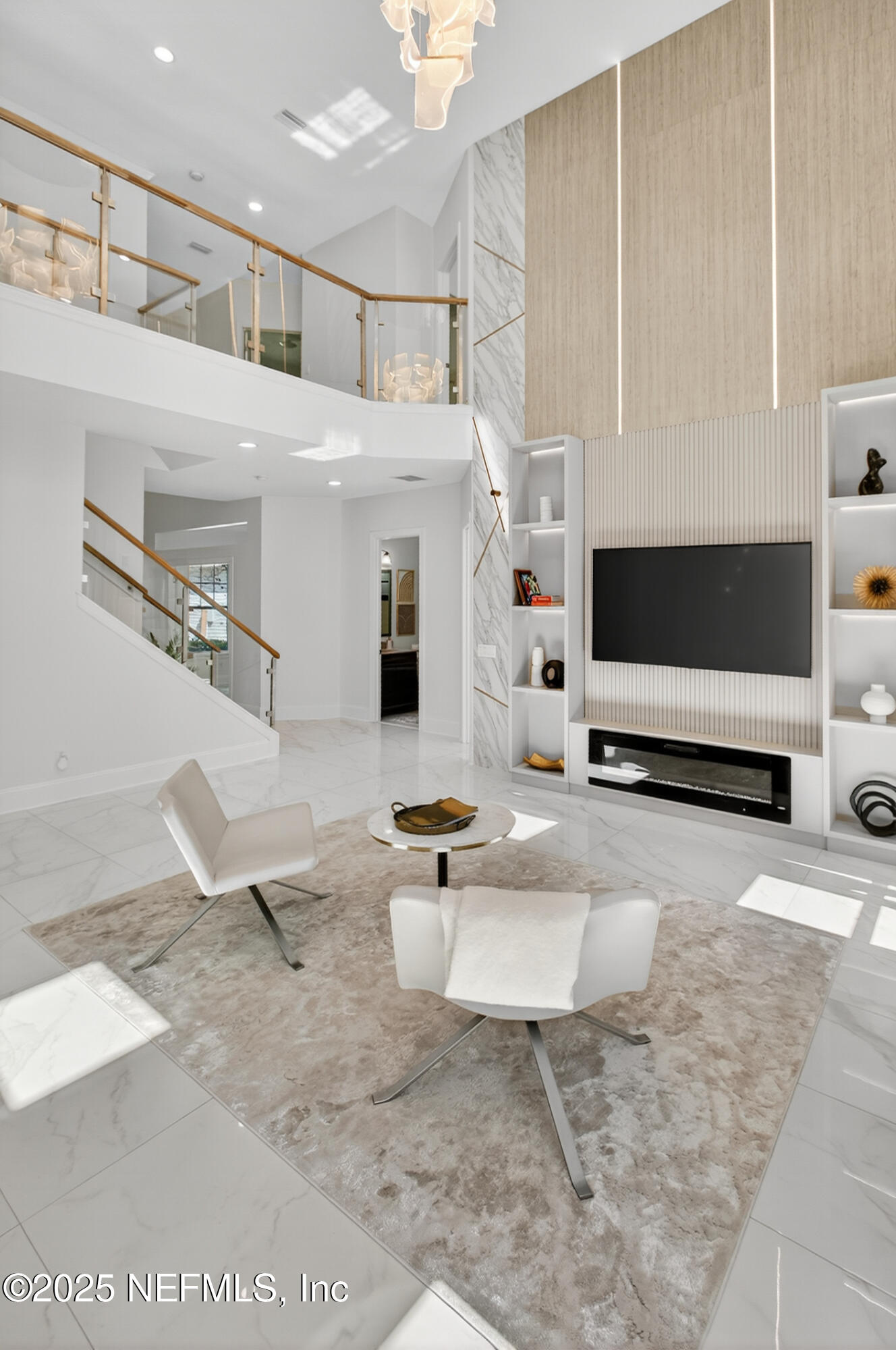 124 Mollusk Road St. Johns, FL 32259 - Photo 29 of 94 a living room with couches and a flat screen tv