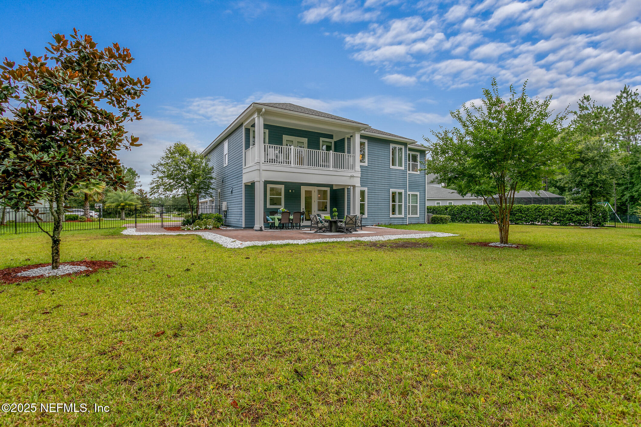 124 Mollusk Road St. Johns, FL 32259 - Photo 70 of 94 a front view of a building with a garden
