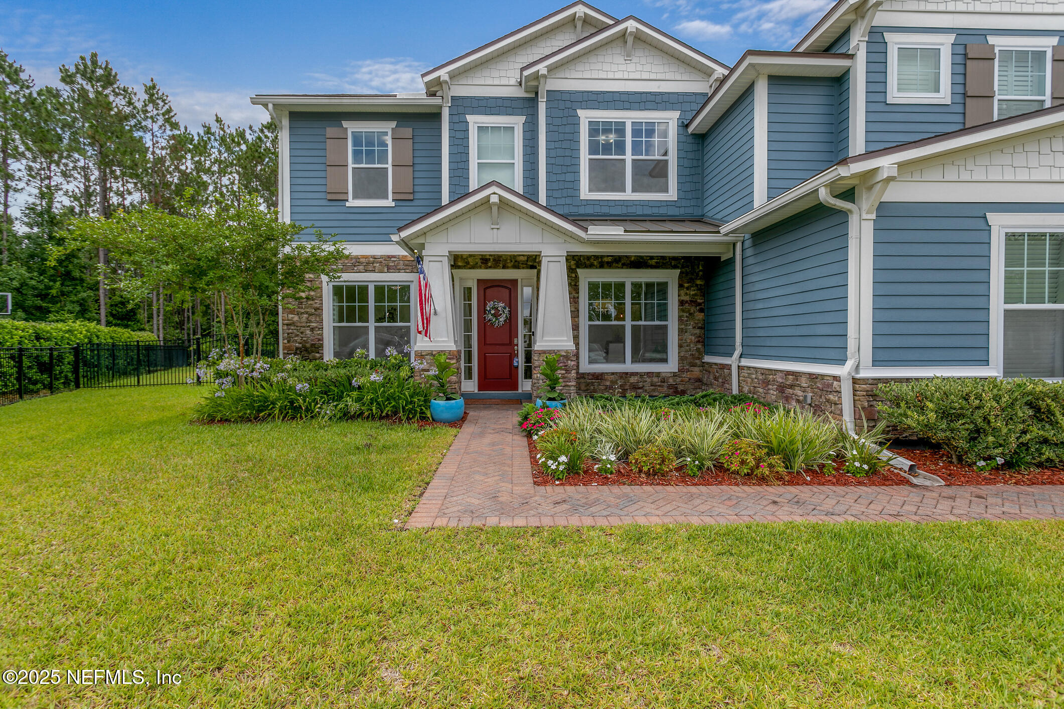 124 Mollusk Road St. Johns, FL 32259 - Photo 7 of 94 a front view of a house with a garden