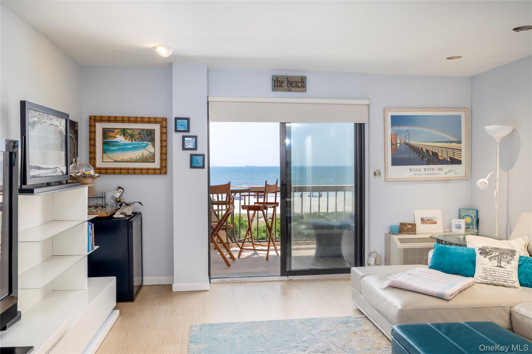 a living room with furniture and large window