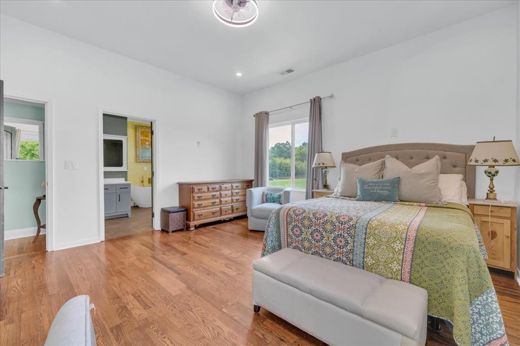 4120 Benjamin Road Caney City, TX 75148 - Photo 18 of 36 Spacious room with wood-finish flooring and white walls