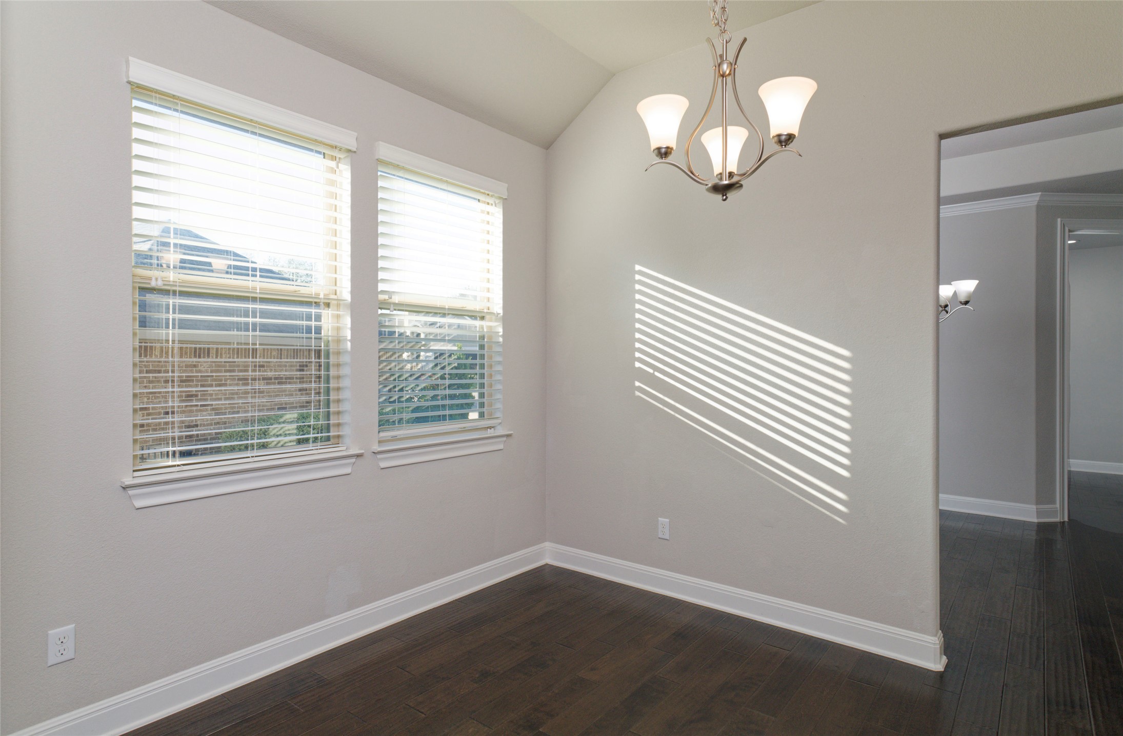 4001 Goodnight Trail Leander, TX 78641 - Photo 11 of 35 a view of an empty room with wooden floor and a window