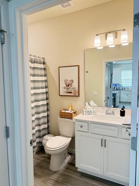 1873 Spring Shower Circle Kissimmee, FL 34744 - Photo 15 of 18 a bathroom with a sink a toilet and shower