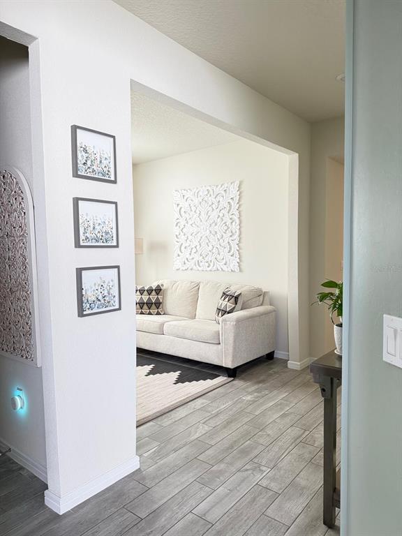 1873 Spring Shower Circle Kissimmee, FL 34744 - Photo 3 of 18 a spacious bedroom with a bed and a couch