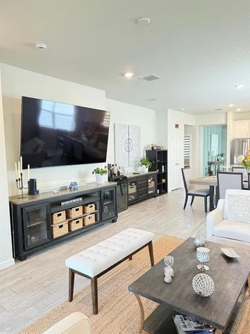 a living room with furniture and a large window