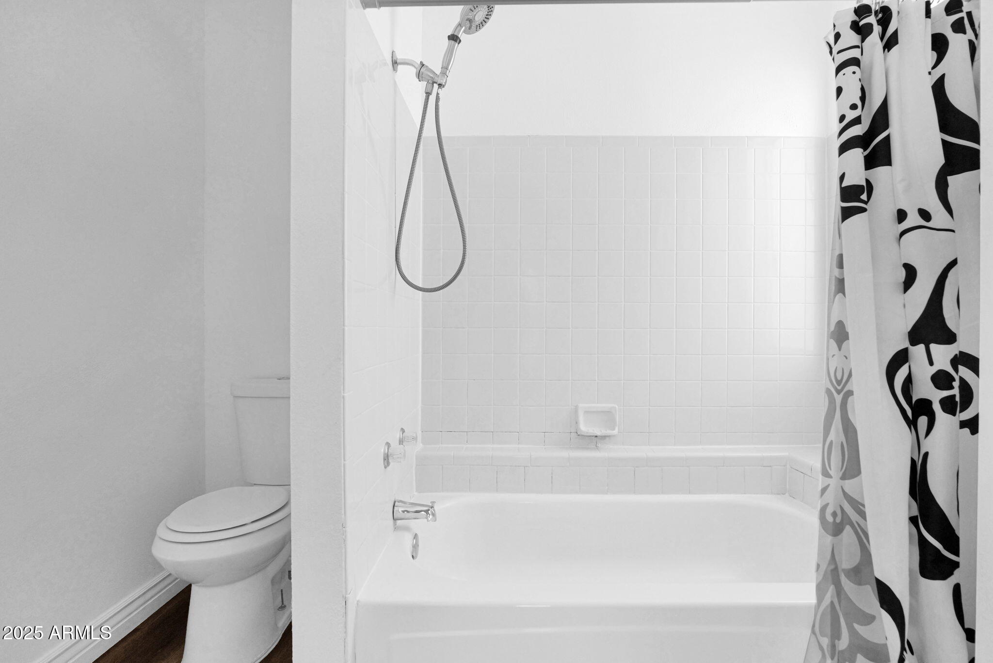 1121 West Manor Street Chandler, AZ 85224 - Photo 11 of 19 a bathroom with a bathtub a toilet and a shower