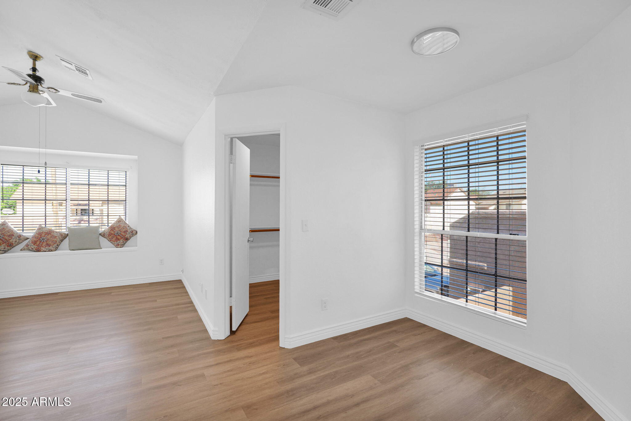 1121 West Manor Street Chandler, AZ 85224 - Photo 10 of 19 an empty room with wooden floor and windows