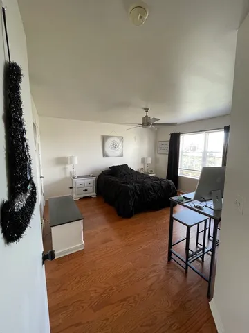 a bedroom with furniture and a window