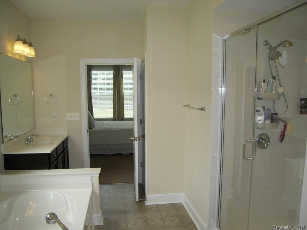 416 Nugget Court, Unit 39 Fort Mill, SC 29708 - Photo 12 of 24 a en suite bathroom with a sink a toilet and shower