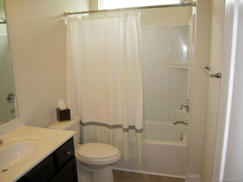 416 Nugget Court, Unit 39 Fort Mill, SC 29708 - Photo 18 of 24 a bathroom with a sink a toilet and shower