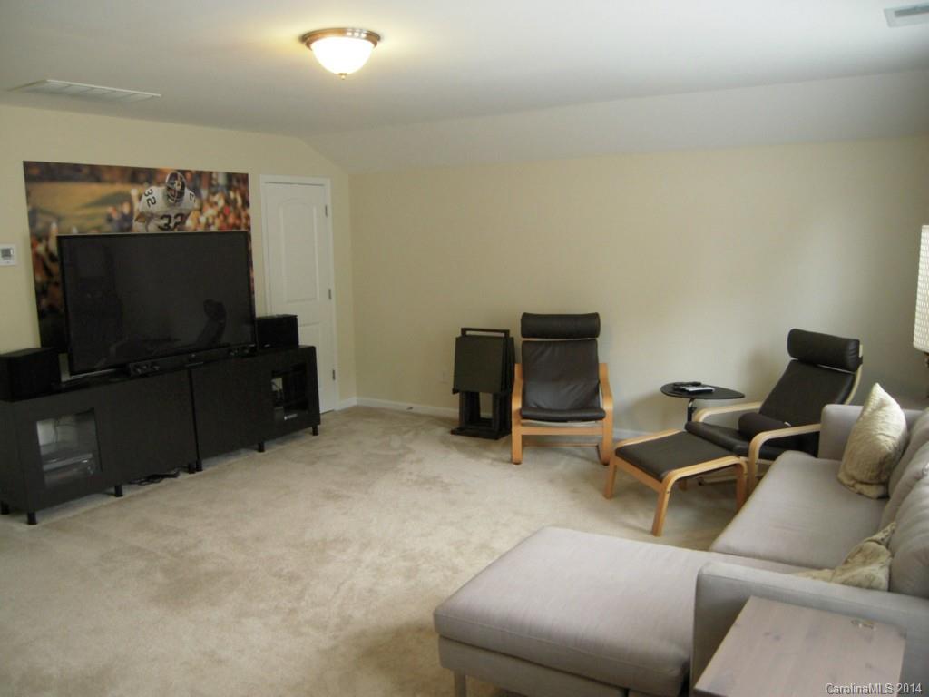 416 Nugget Court, Unit 39 Fort Mill, SC 29708 - Photo 19 of 24 a living room with furniture and a flat screen tv