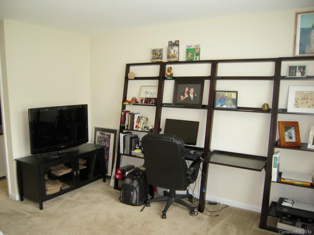 416 Nugget Court, Unit 39 Fort Mill, SC 29708 - Photo 21 of 24 a living room with furniture a flat screen tv and a window