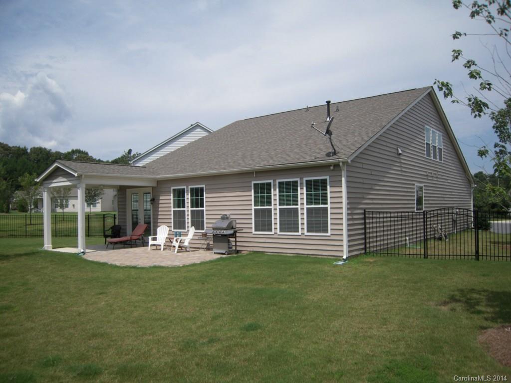 416 Nugget Court, Unit 39 Fort Mill, SC 29708 - Photo 23 of 24 a front view of a house with a garden and sitting area