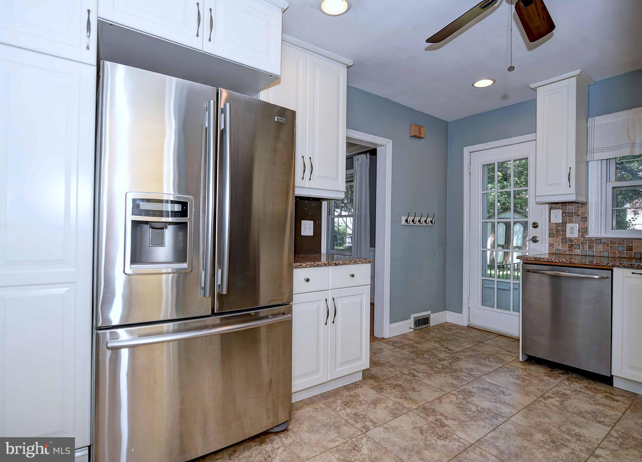 1824 Glen Ridge Road Parkville, MD 21286 - Photo 22 of 38 a kitchen with stainless steel appliances granite countertop a refrigerator a stove a sink and a refrigerator