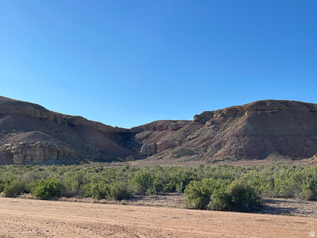 240 Horseshoe Bend Road Vernal, UT 84078 - Photo 5 of 41 Expansive desert landscape featuring rugged mountains and abundant low-lying brush