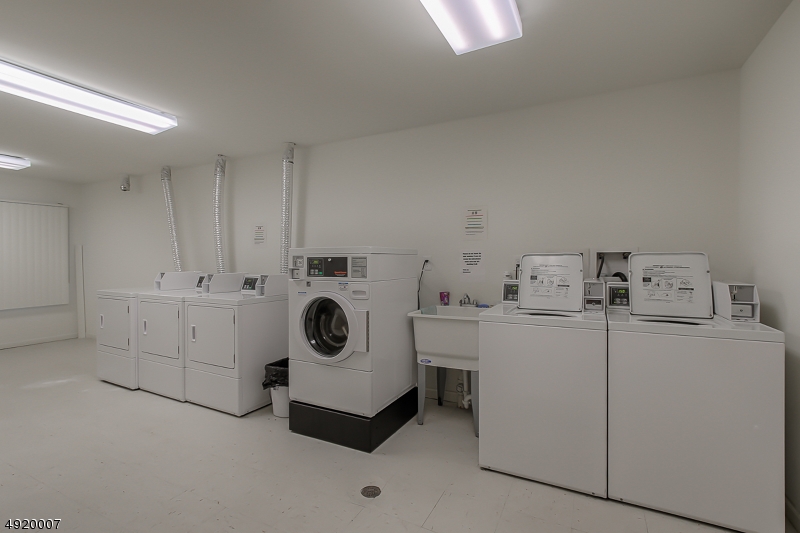 2889 Highway 10, Unit 2301 Morris Plains, NJ 07950 - Photo 9 of 16 a utility room with dryer and washer