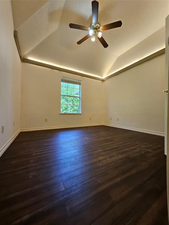234 East Fork Road Sunnyvale, TX 75182 - Photo 12 of 32 an empty room with wooden floor fan and window