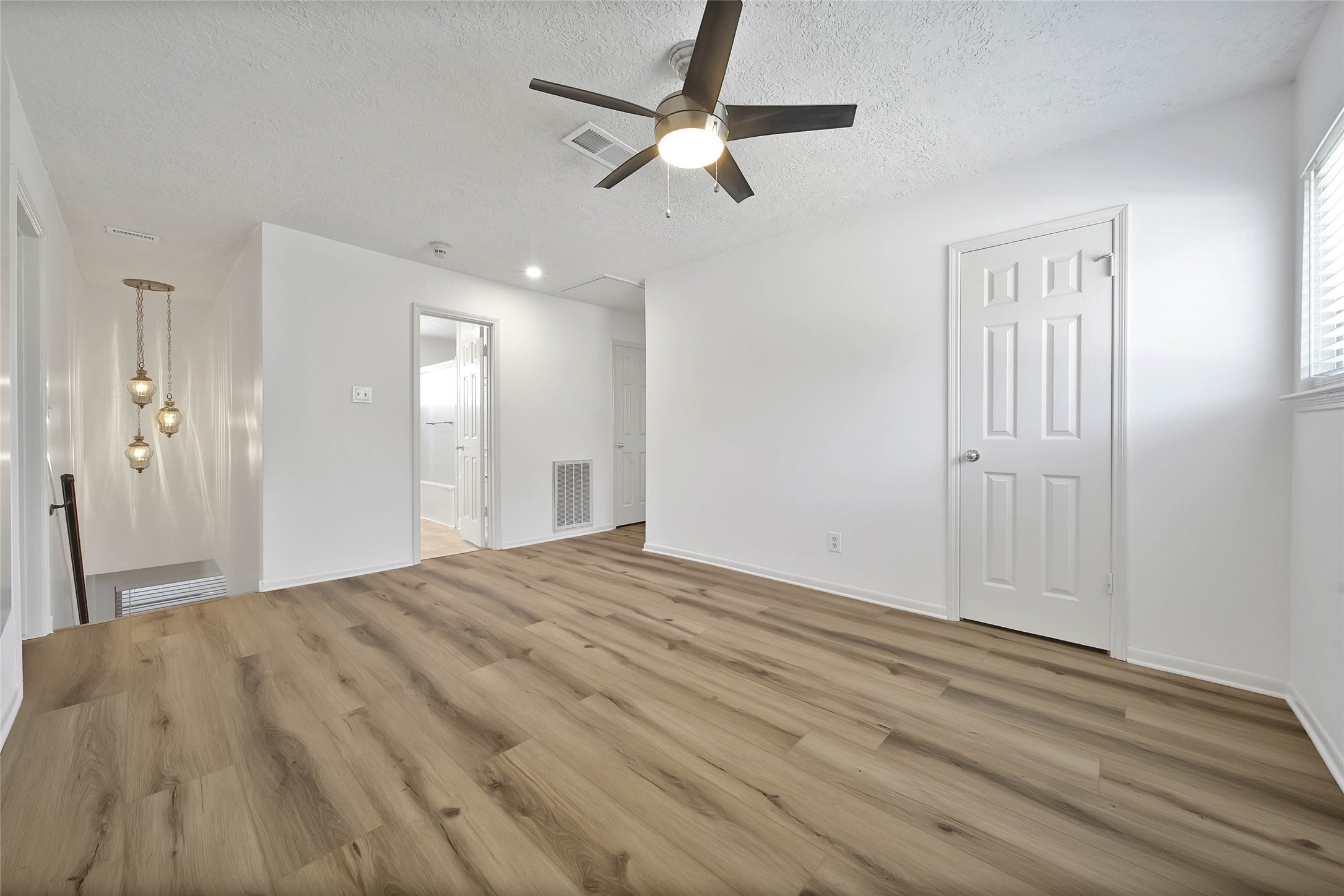 9411 Roos Road Houston, TX 77036 - Photo 31 of 44 The Upstairs Flex Room with Wood-Look Flooring Offers a Closet and Can Be Used in Many Ways. P