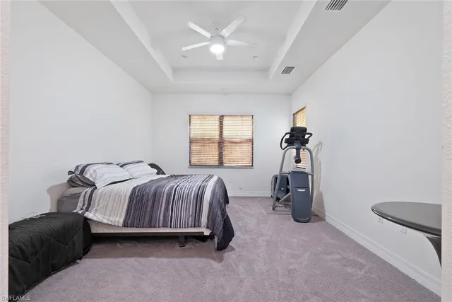 a bedroom with a bed and a table