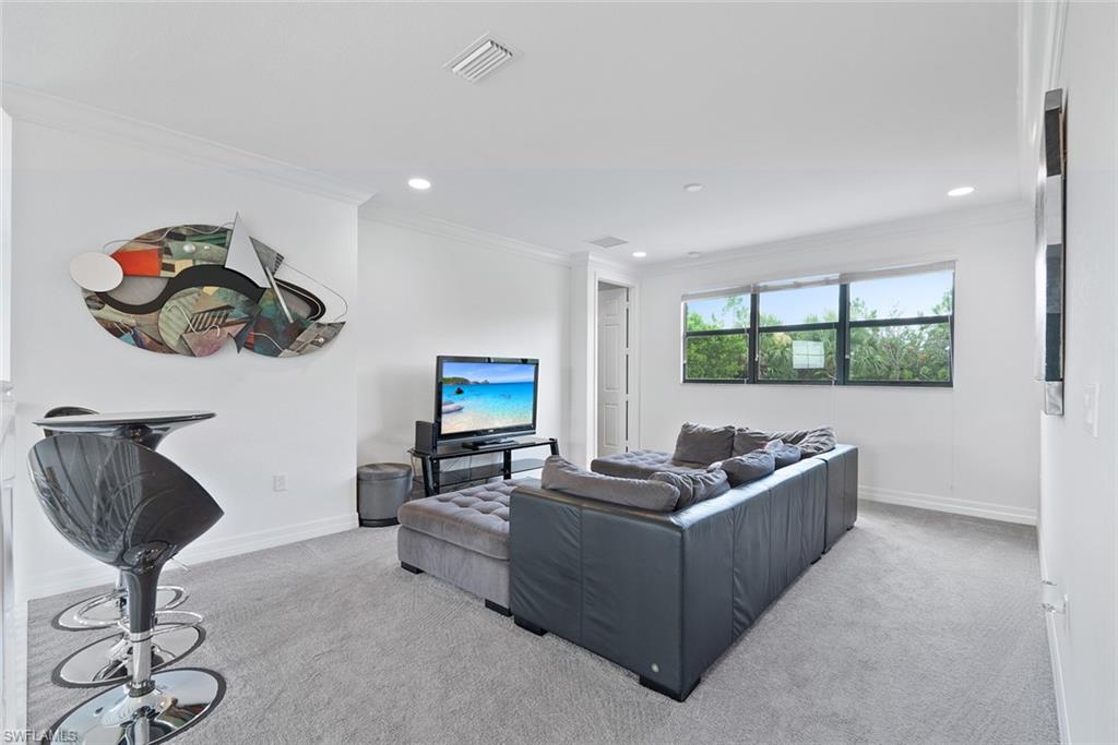 13750 Callisto Avenue Naples, FL 34109 - Photo 20 of 46 a living room with furniture and a window