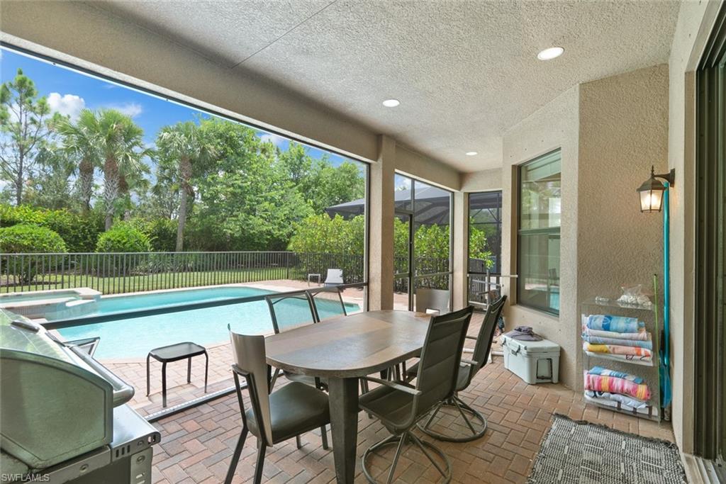 13750 Callisto Avenue Naples, FL 34109 - Photo 26 of 46 a view of a dining room with furniture window and outside view