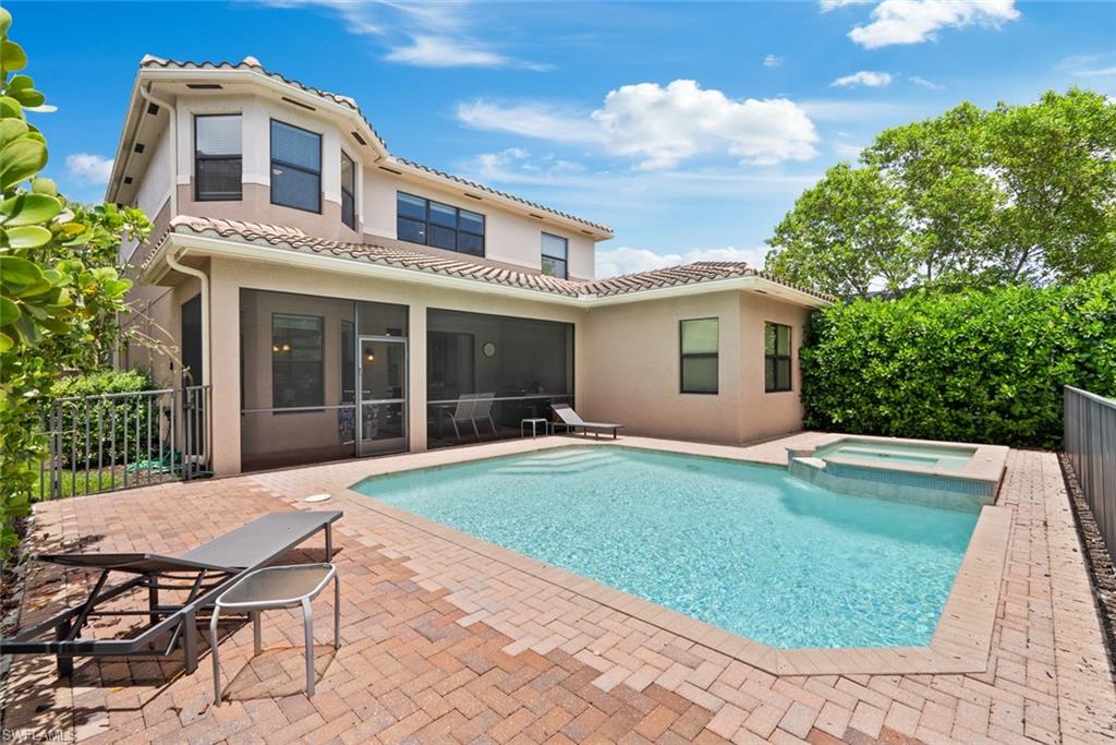 13750 Callisto Avenue Naples, FL 34109 - Photo 28 of 46 a view of a house with backyard sitting area and garden