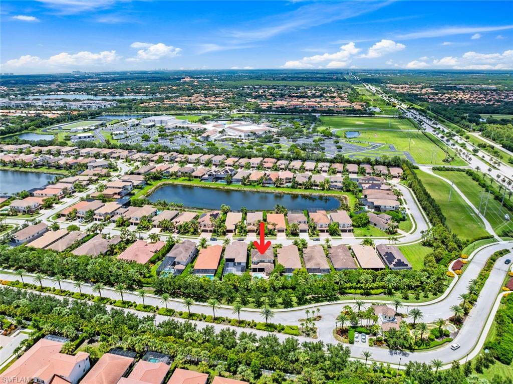 13750 Callisto Avenue Naples, FL 34109 - Photo 29 of 46 an aerial view of residential houses with outdoor space and street view