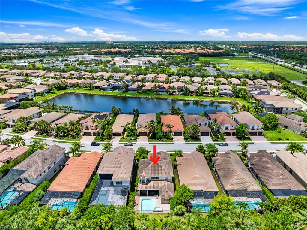 13750 Callisto Avenue Naples, FL 34109 - Photo 30 of 46 an aerial view of swimming pool outdoor seating and outdoor space