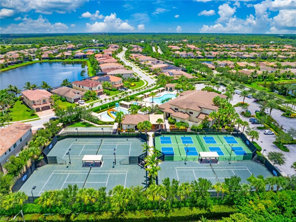 13750 Callisto Avenue Naples, FL 34109 - Photo 32 of 46 an aerial view of a house with a garden and lake view